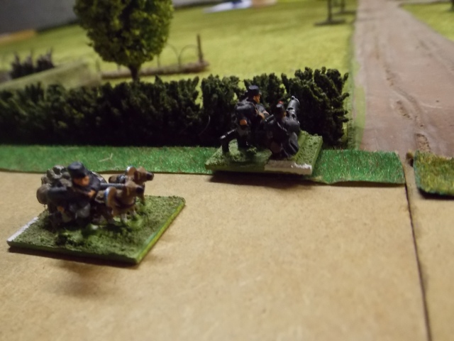 A Belgian HMG set up to cover the road while the dogs remain close by.